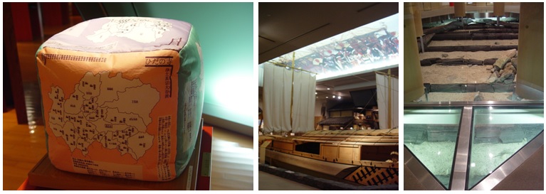 由左至右依序為日本宗教分布圖展示項/丸子船上方螢幕，正播放慶典/7世紀建造的瀨田唐橋的橋腳基墩。